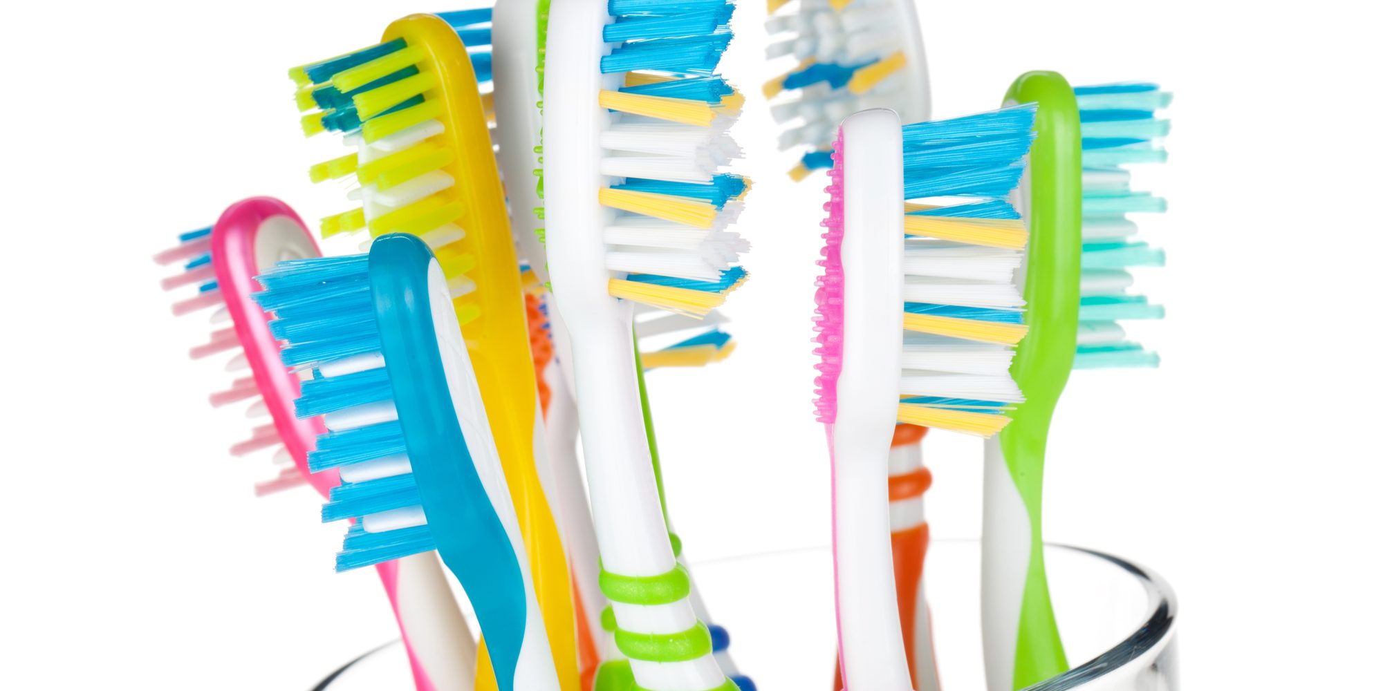 Colorful toothbrushes in glass